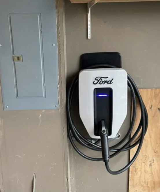 CDS Energy Services — Licensed electrician installing a Level 2 EV charger in a Maine garage