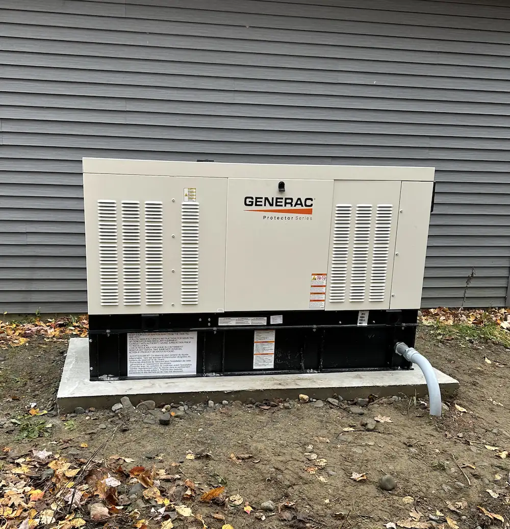 CDS Energy Services — Licensed electrician Dereck Shaw installing a Generac standby generator in Maine