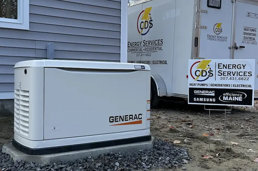 Generac standby generator installed beside a Maine home